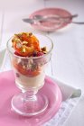 Closeup view of peach Melba with raspberries in glass — Stock Photo