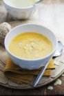Butternut squash soup with slivered almonds — Stock Photo