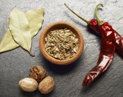 Fennel seeds and dried chili peppers — Stock Photo