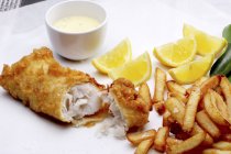 Battered hake with dip and chips — Stock Photo