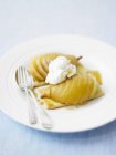 Pear tartlets topped with whipped cream — Stock Photo