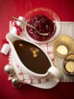Closeup view of gravy and cranberry sauce — Stock Photo