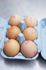 Brown eggs with stamps — Stock Photo