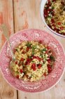 Farro salad with pomegranate seeds and parsley — Stock Photo