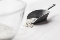 Flour in a metal scoop — Stock Photo