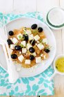 Grapefruit with feta and olives salad — Stock Photo