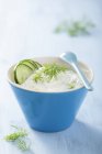 Tzatziki with cucumber and dil in blue bowl — Stock Photo