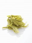 Green tagliatelle pasta — Stock Photo