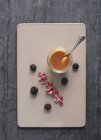 Top view of Creme caramel with red currant, and blackberries — Stock Photo