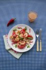 Closeup view of grapefruit and prawn salad with chili, lemongrass, basil and grated coconut — Stock Photo