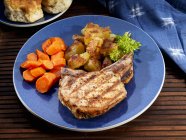 Pork chop with carrots — Stock Photo