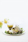 Fish with capers and lemons — Stock Photo