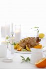 Roasted chicken with lemons and oranges — Stock Photo