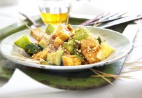 Rojak salad with vegetables and fruits from Malaysia on white plate over tray — Stock Photo