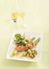 Salmon fillet on an asparagus salad — Stock Photo