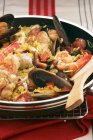Paella rice dish with chicken — Stock Photo
