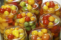 Tomatoes preserved in jars — Stock Photo