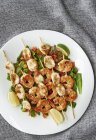 Seafood skewers with prawns and squid — Stock Photo
