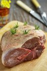 Raw seasoned lamb with rosemary — Stock Photo