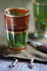 Mint tea in an oriental glass — Stock Photo