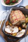 Stuffed turkey breast wrapped in bacon — Stock Photo