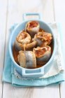 Rolled herring with onions and tomatoes — Stock Photo