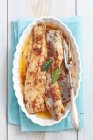 Marinated herring with dried tomato pesto — Stock Photo