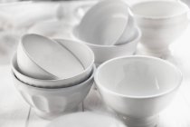Closeup view of white ceramic bowls — Stock Photo