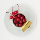 Opened tin of cocktail cherries — Stock Photo