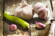 Pink garlic and green chilli pepper — Stock Photo