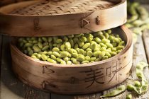 Edamame beans in steamer basket — Stock Photo