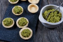 Mini tartlets with broccoli pure — Stock Photo