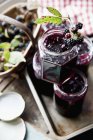 Blackberry jam in stacked jars — Stock Photo