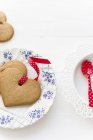 Gingerbread biscuits with ribbons — Stock Photo
