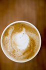 Cup of cappuccino with foam — Stock Photo