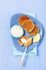 Salmon cakes with a dip — Stock Photo