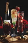 Christmas cocktails with a bottle of champagne — Stock Photo