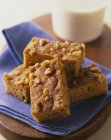 Closeup view of Blondies with pecan nuts on purple towel — Stock Photo