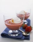 Strawberry ice cream garnished with cream — Stock Photo