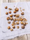 Hazelnuts over wooden background — Stock Photo