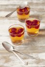 Orange jelly with raspberries — Stock Photo