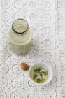 Elevated view of homemade almond milk with Matcha tea — Stock Photo