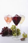 Glasses of wine with ice cubes — Stock Photo