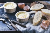 Baked eggs with bread — Stock Photo