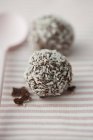 Chocolate pralines with flakes — Stock Photo