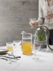 Jug of punch on a table — Stock Photo