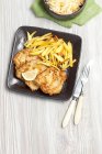 Roasted Pork chops with potato chips — Stock Photo