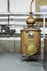 Tanks, tubes and machinery in ouzo factory — Stock Photo