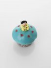 Cupcake decorated with bee figure — Stock Photo