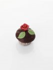 Cupcake with marzipan rose — Stock Photo